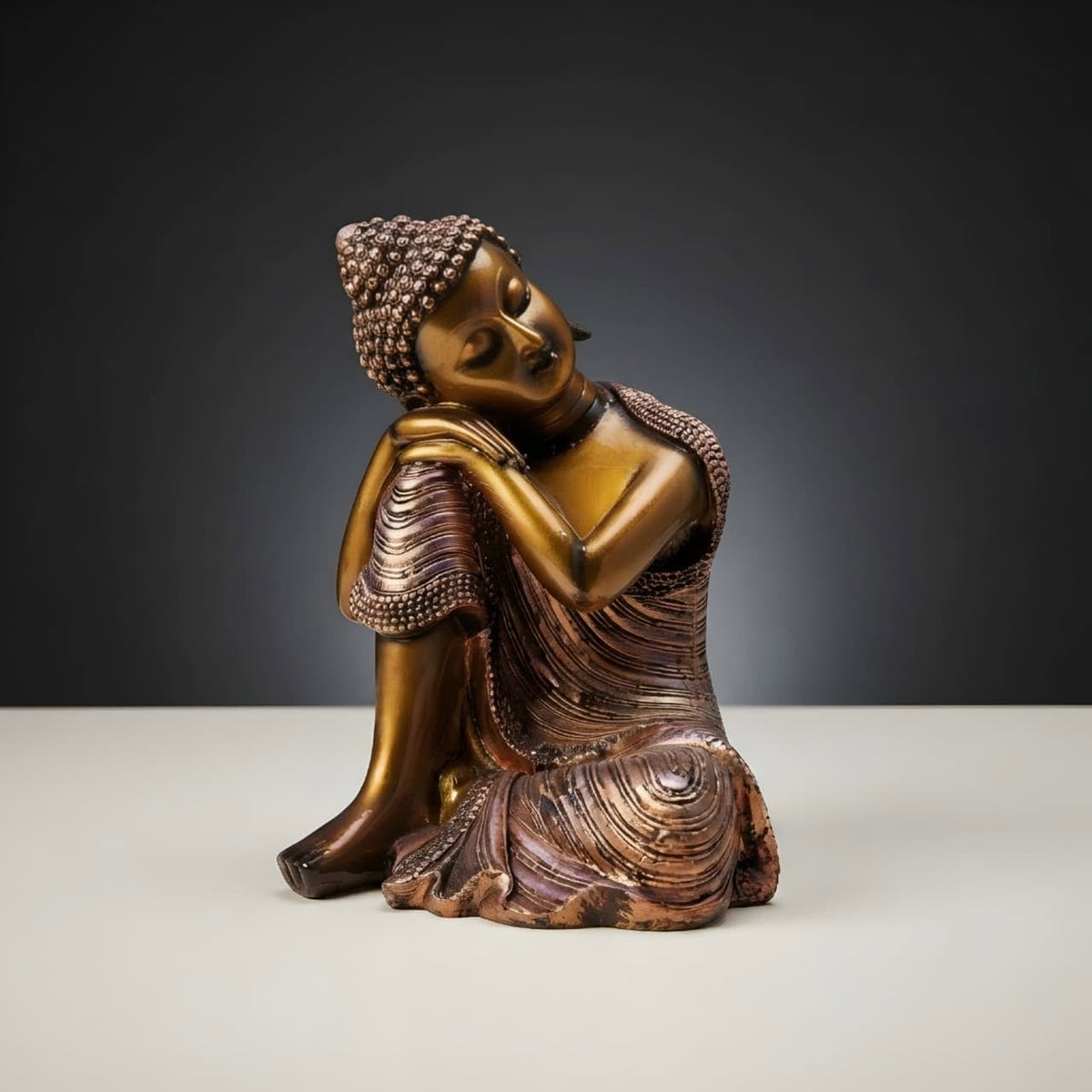 Resting Buddha Figurine with Bronze Finish GI004, angled view